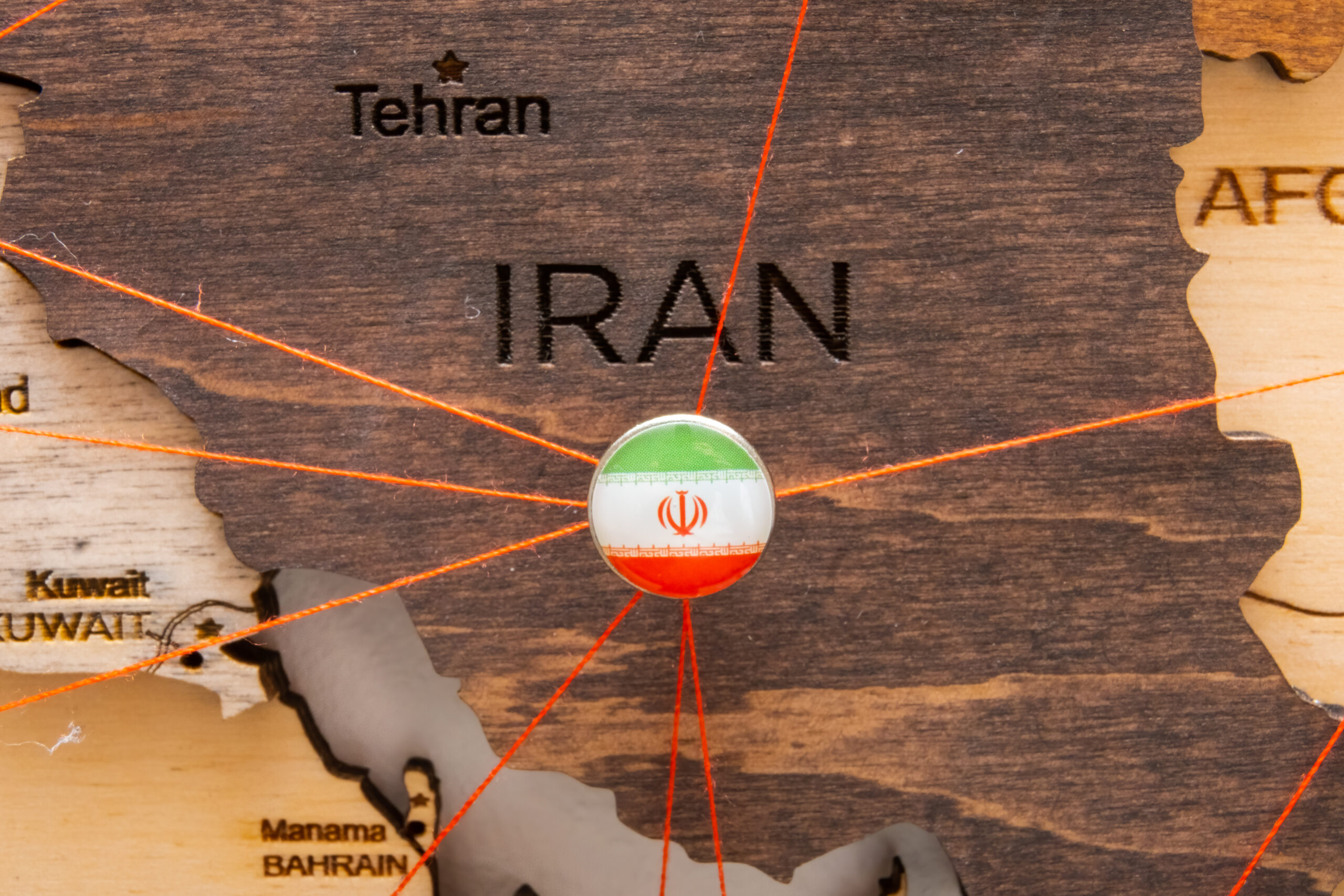 iran flag on the pushpin and red threads on the wo 2026 01 08 06 24 34 utc scaled