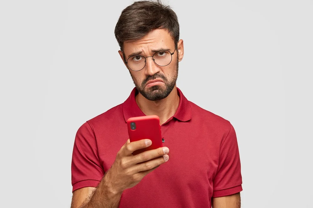 photo of displeased young unshaven guy holds moder 2026 01 07 01 12 50 utc