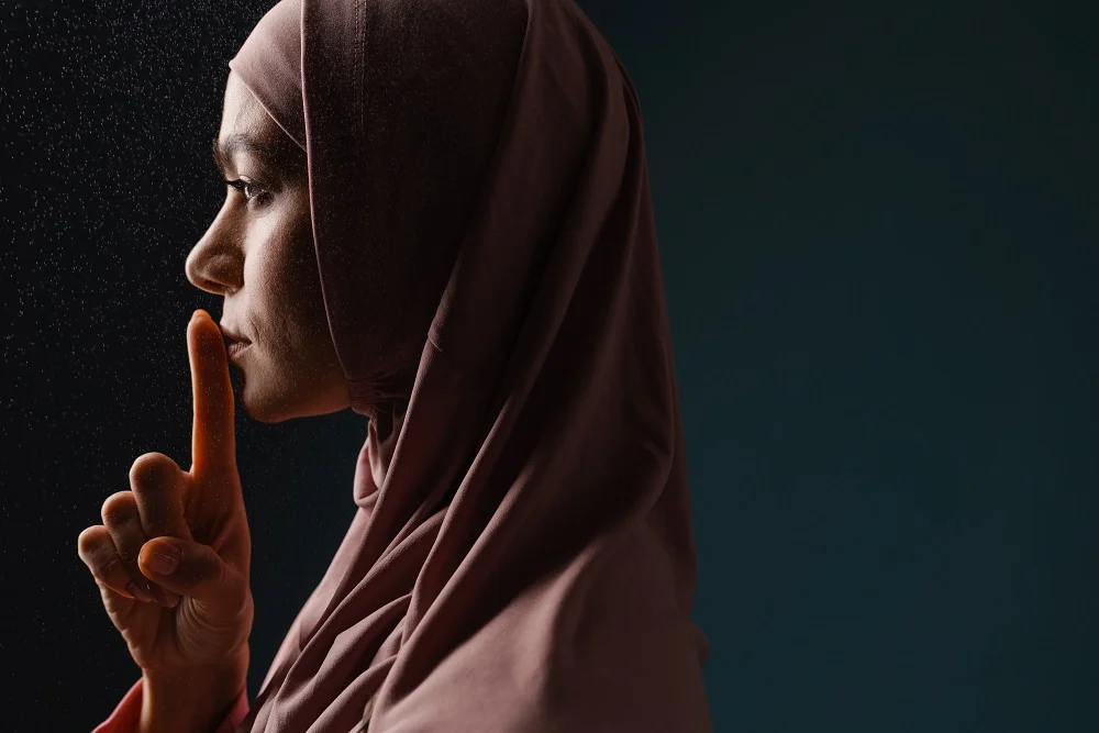 young muslim woman in hijab showing silence gestur 2026 01 08 05 37 42 utc