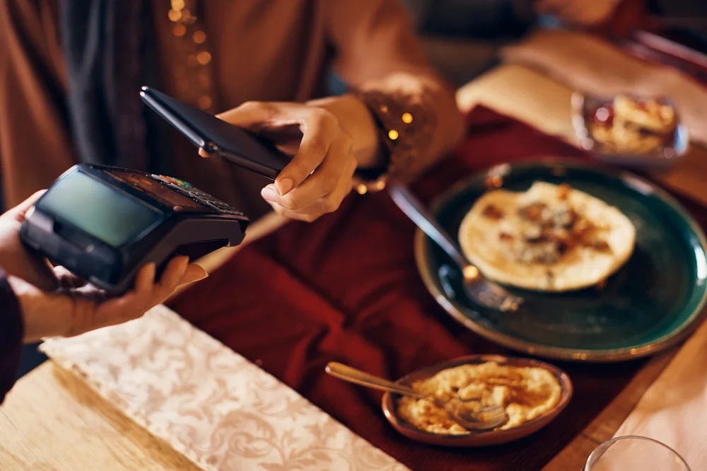 close up of woman using smart phone while paying t 2026 01 07 01 28 24 utc