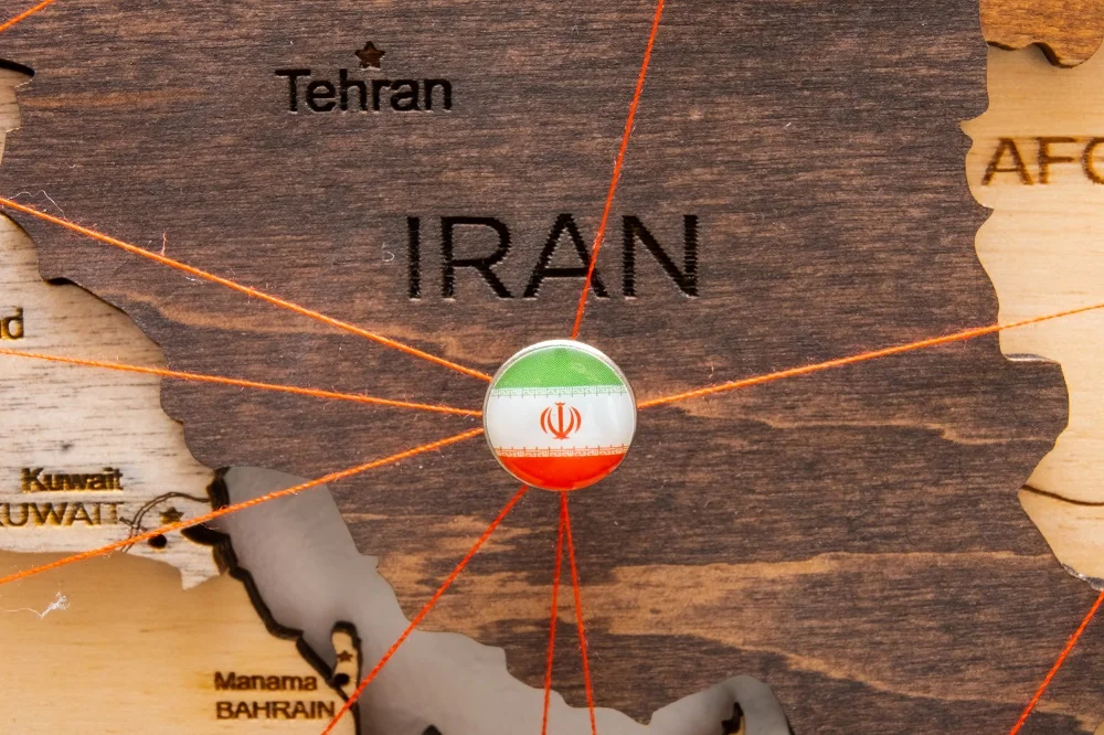 iran flag on the pushpin and red threads on the wo 2026 01 08 06 24 34 utc