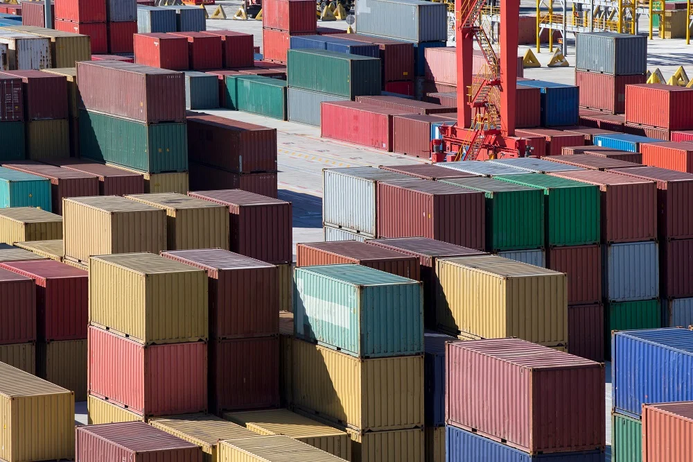multicolored cargo containers stacked at a commerc 2026 01 11 09 44 33 utc
