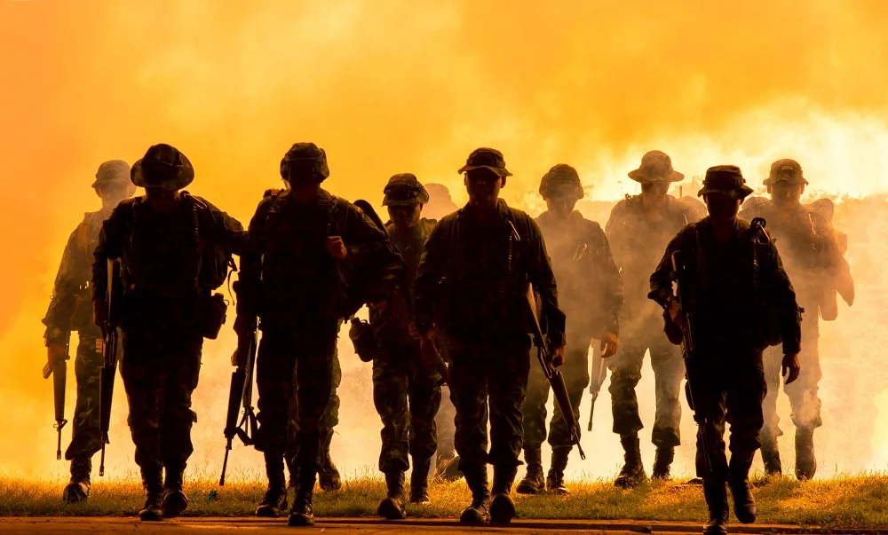 silhouette of soldiers walking against smoke and s 2026 01 07 07 27 24 utc