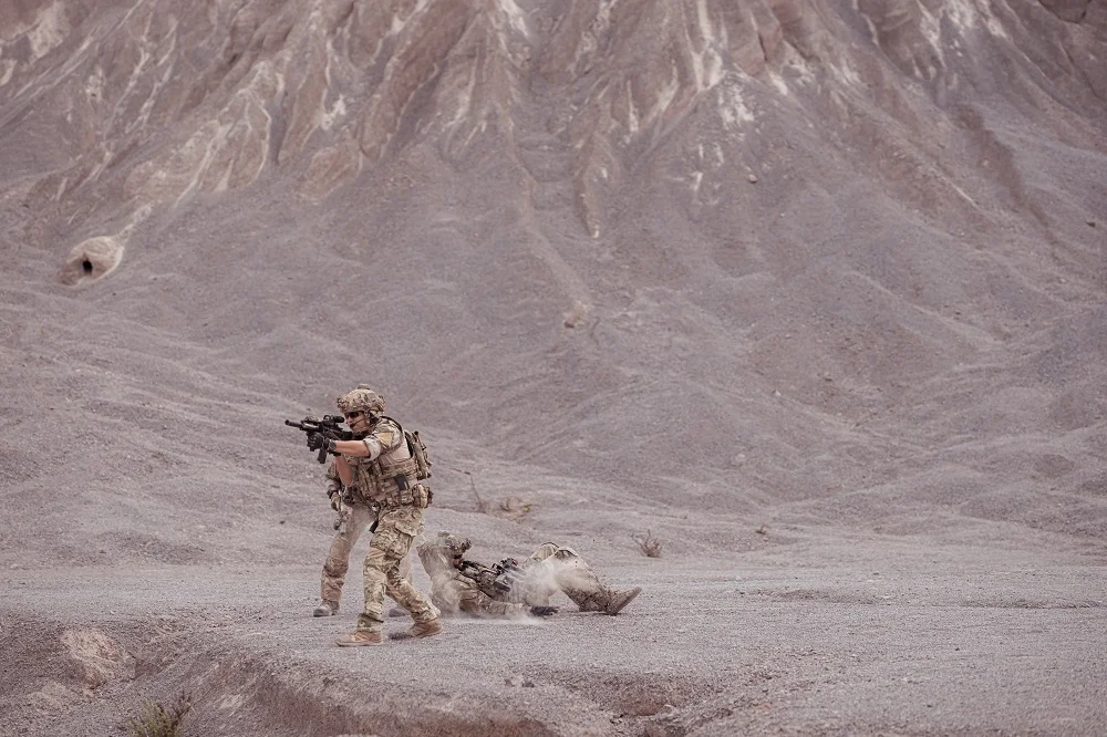 soldiers in camouflage military uniforms carrying 2026 03 17 00 08 04 utc