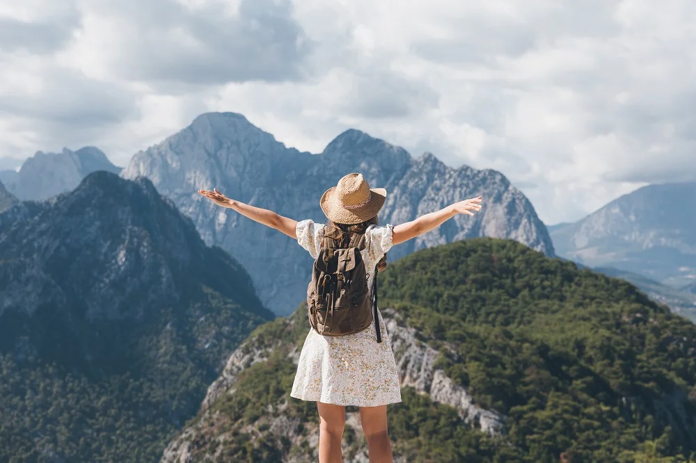 young woman with a backpack hiking in the mountain 2026 01 07 06 12 45 utc
