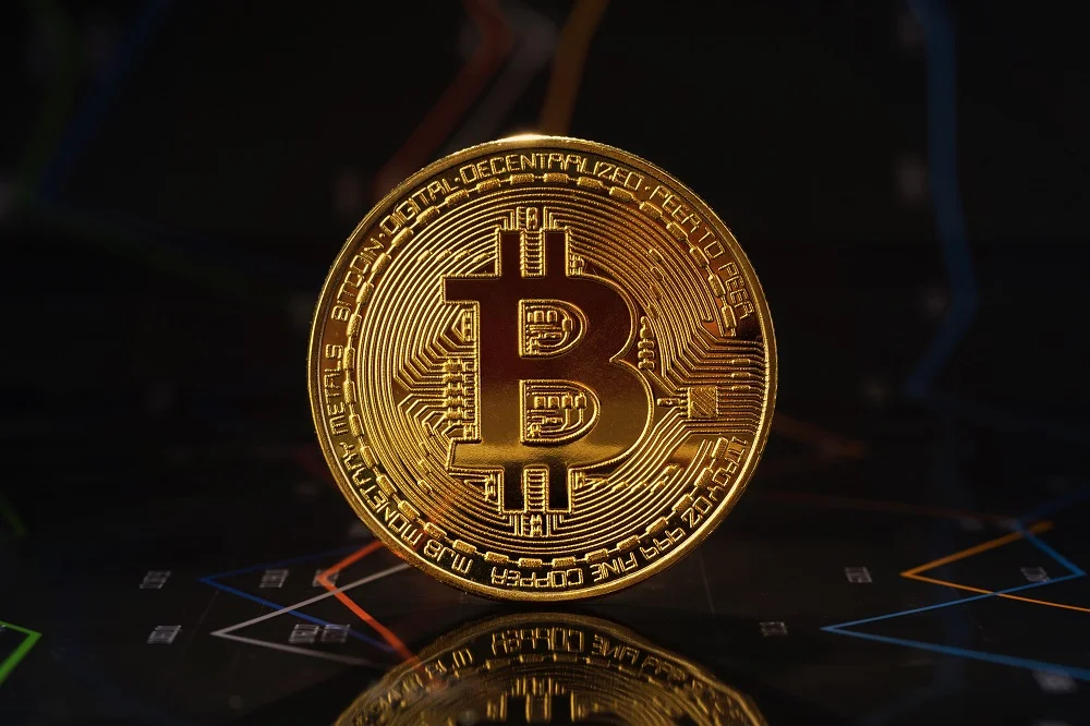 gold bitcoin standing on financial graphs for cryp 2026 03 24 06 29 14 utc