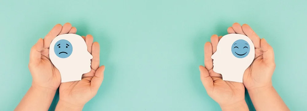 holding a head with a sad and a happy face in the 2026 03 18 09 51 43 utc