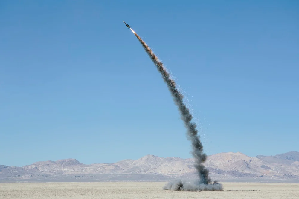 rocket shooting into vast desert sky black rock 2026 03 25 01 40 50 utc