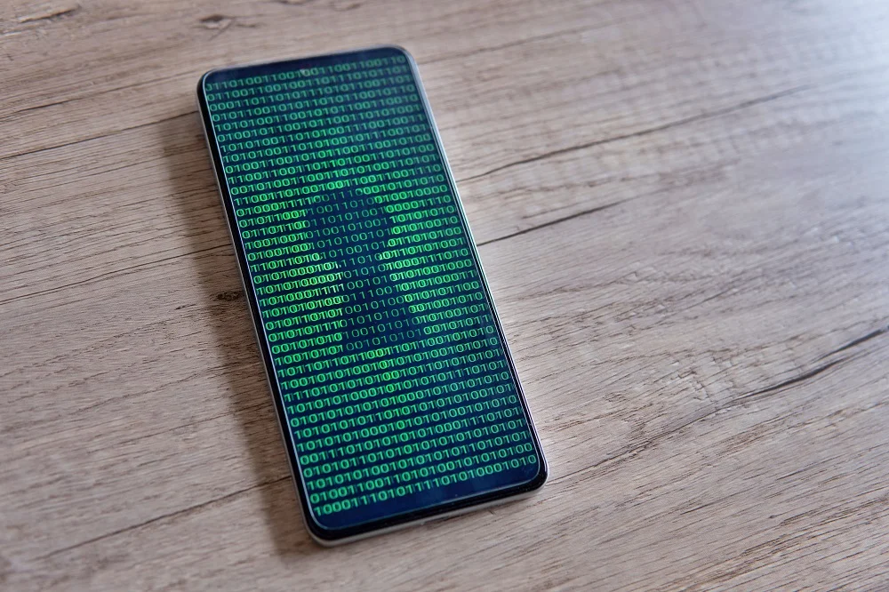 smartphone with glowing binary code and keyhole on 2026 01 08 07 50 22 utc