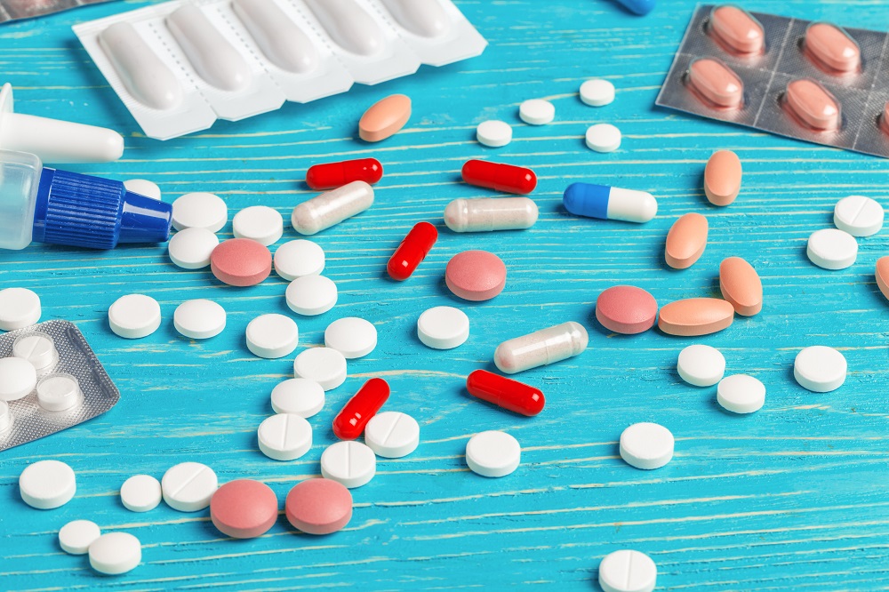 assortment of colorful medicine on a blue table 2026 03 19 23 07 24 utc