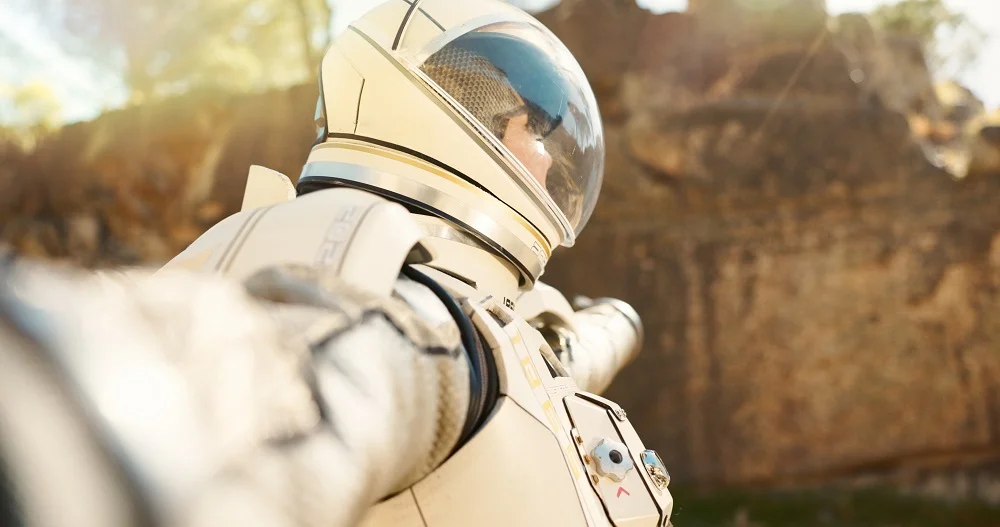 astronaut in arid landscape exploring distant worl 2026 03 25 04 01 10 utc