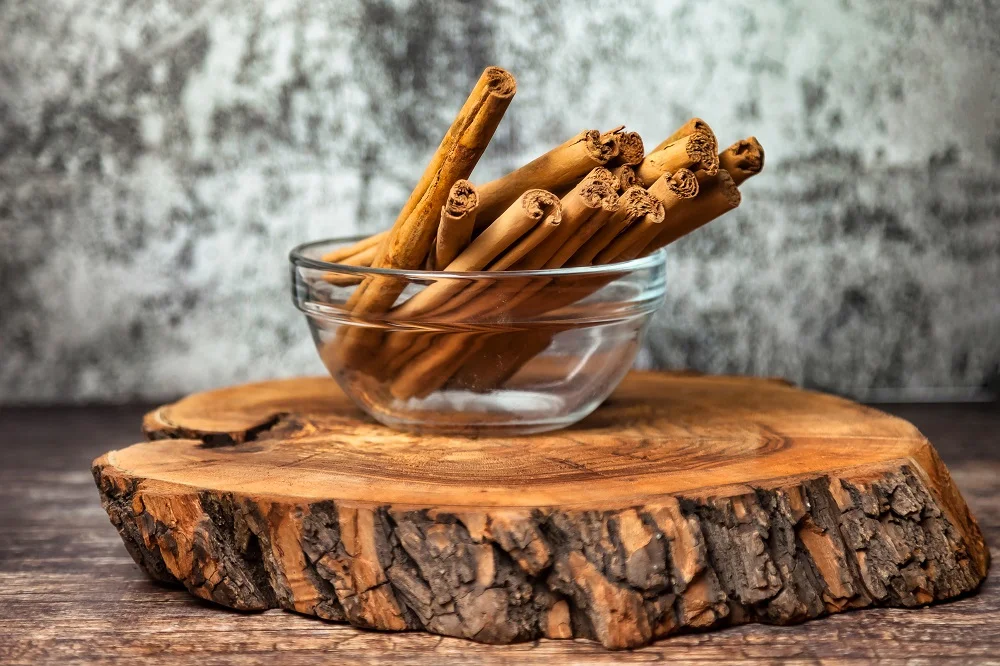 close up of cinnamon sticks in a glass bowl on a w 2026 01 11 10 54 10 utc