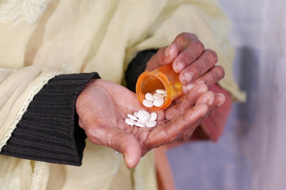 close up of pills and capsule on senior women s ha 2026 03 16 03 24 33 utc