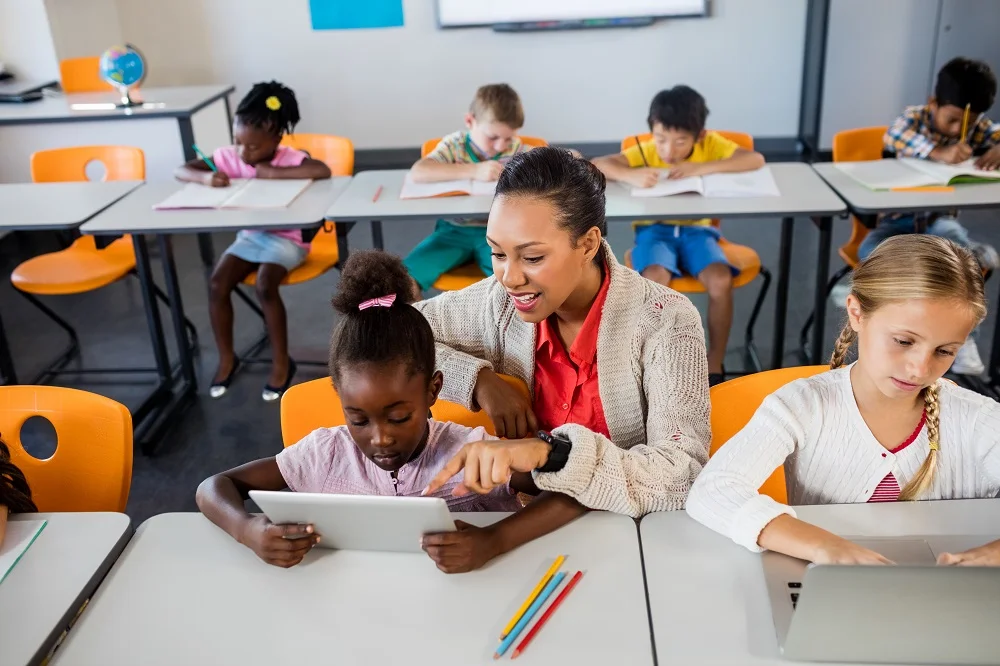 elementary school students working at desks with t 2026 03 26 11 52 06 utc