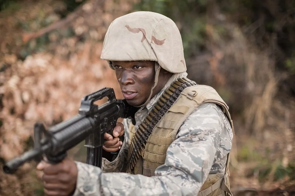 focused soldier aims rifle in camouflage gear 2026 01 09 08 31 00 utc