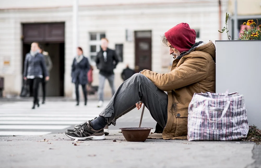homeless beggar man sitting outdoors in city askin 2026 03 10 02 04 25 utc
