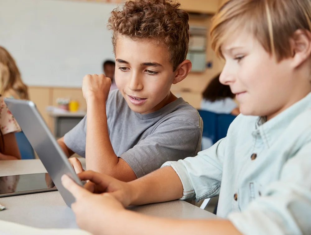 schoolboys working together with tablet computer 2026 03 10 03 14 24 utc